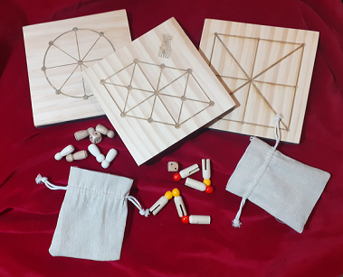 A picture showing the two tokens given to those who entered the Event Embellishment, Elaboration, and Edification A&S Challenge